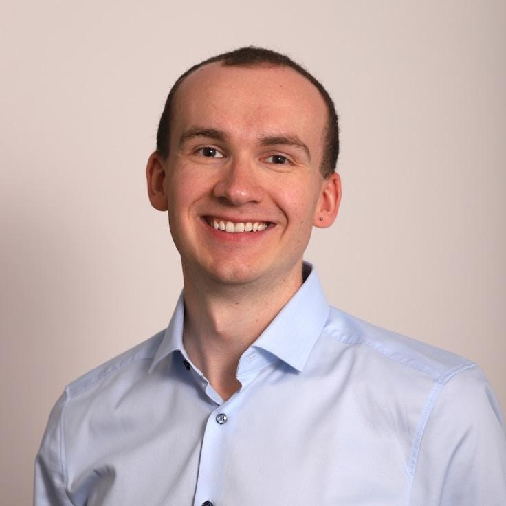 Jordan Patel, Client Relations Director, discussing corporate gifting strategy with business clients